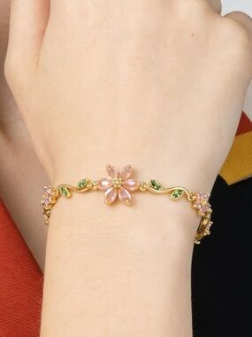 Anthropologie Gold-Tone Bracelet with Pink Flower and Green Leaf Accents